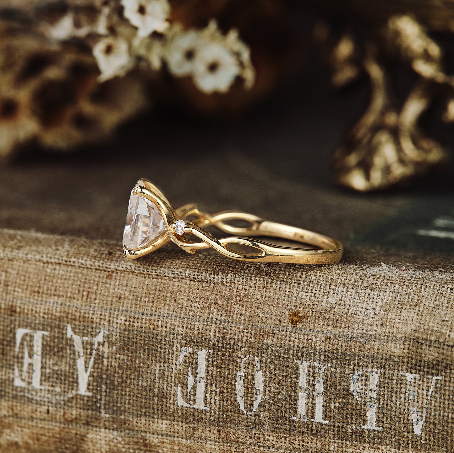 Floral engagement ring showcasing large oval moissanite and twisted gold band