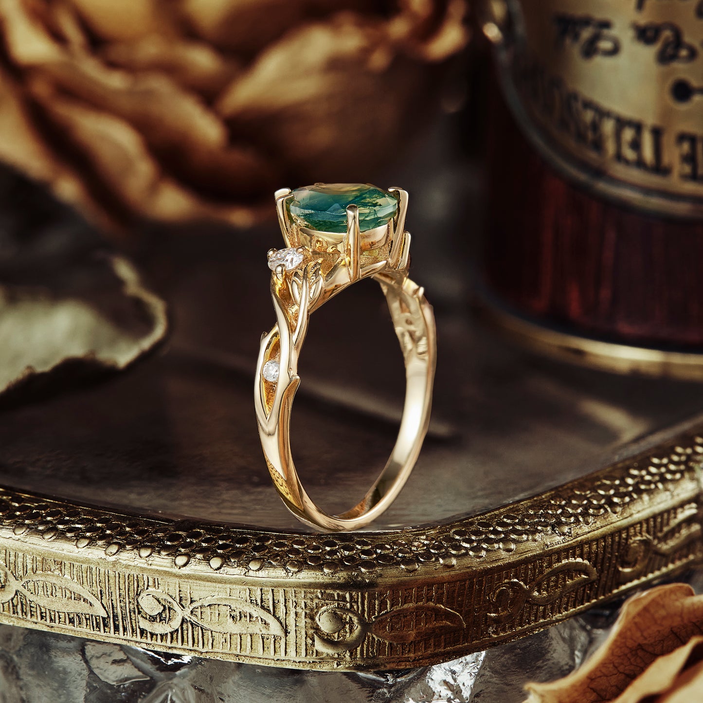 Unique leaf and vine engagement ring with moss agate and moissanite in gold
