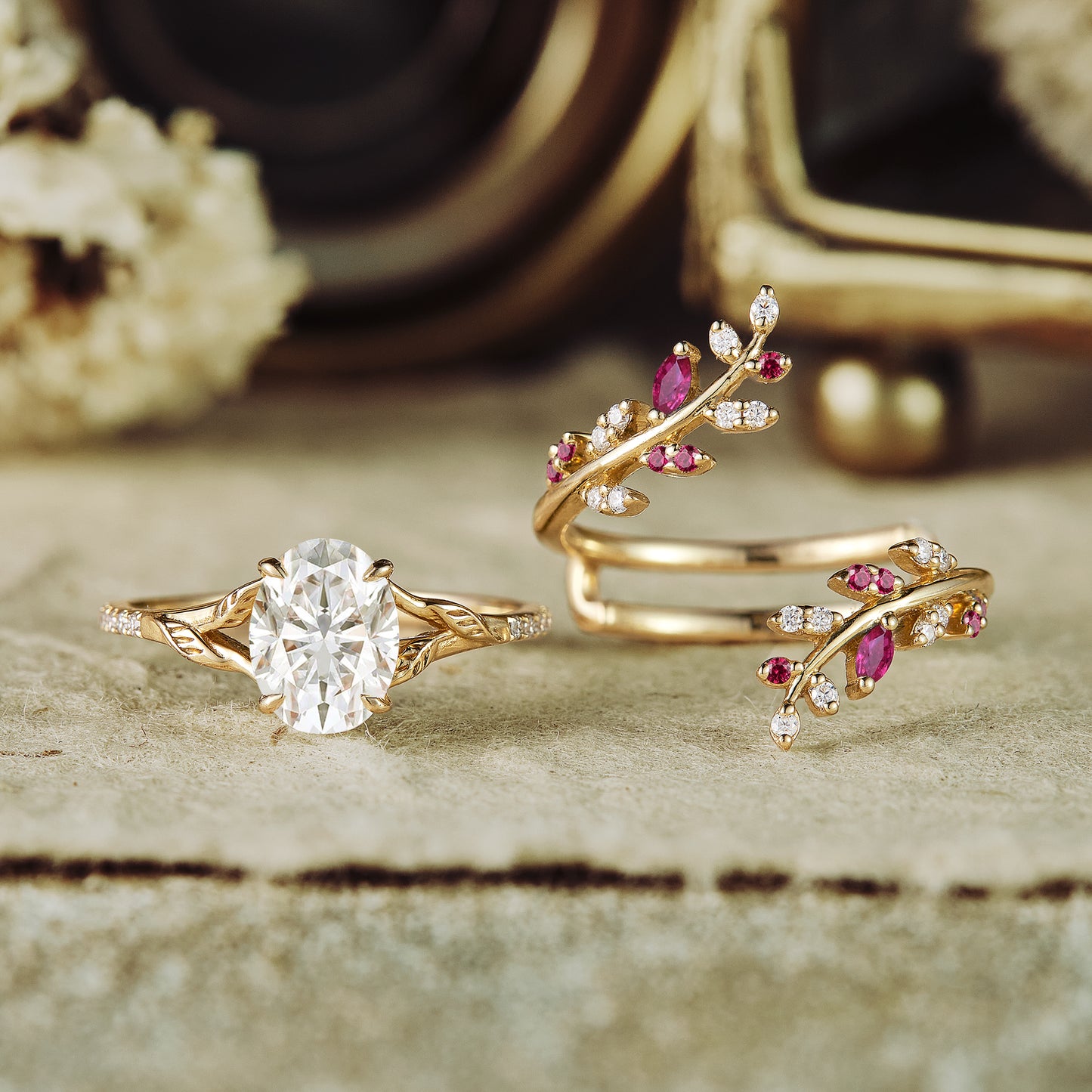 Oval moissanite and ruby accent nature-inspired ring set in gold with floral details
