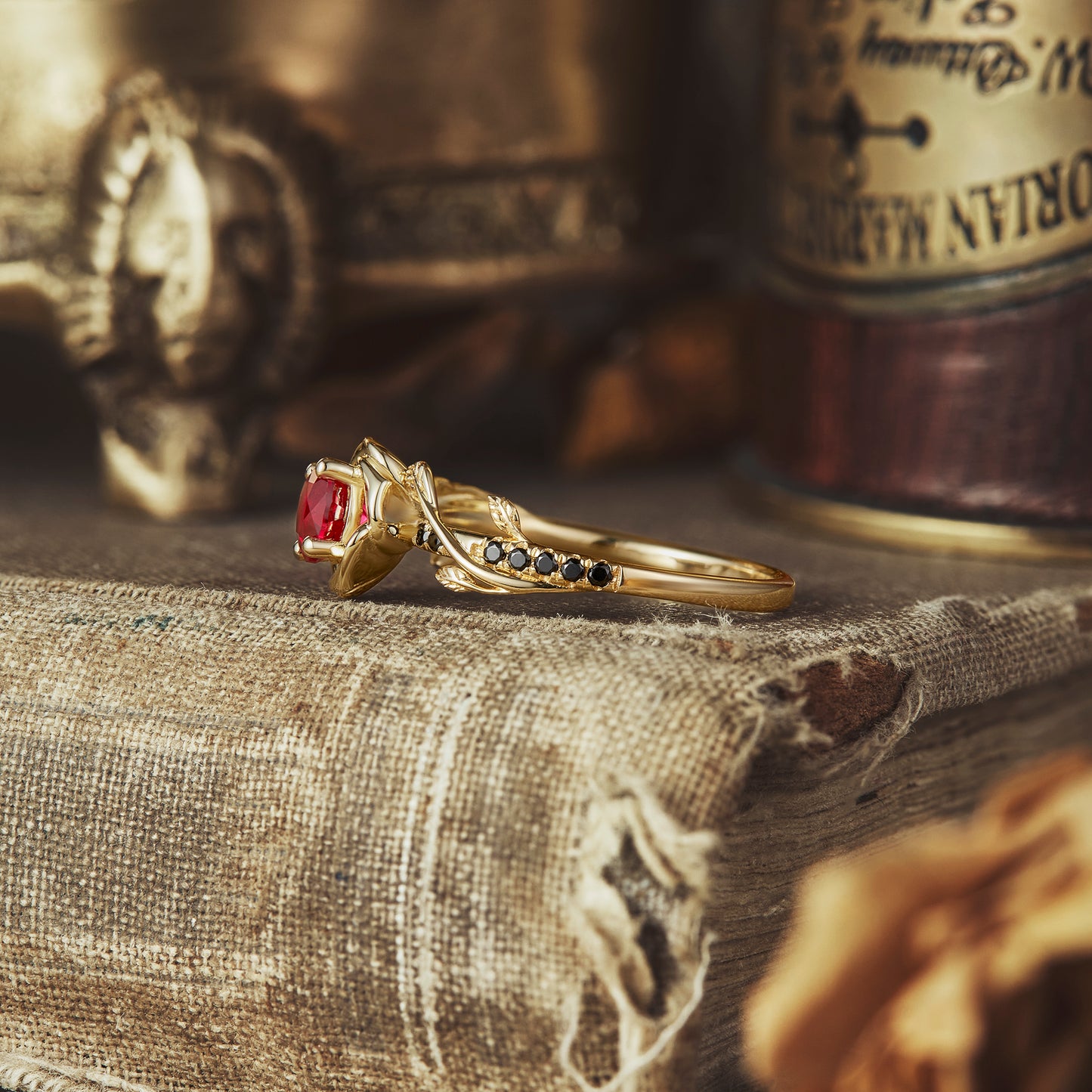 Side view of Blooming Rose ring with lab-created ruby and black onyx in gold setting
