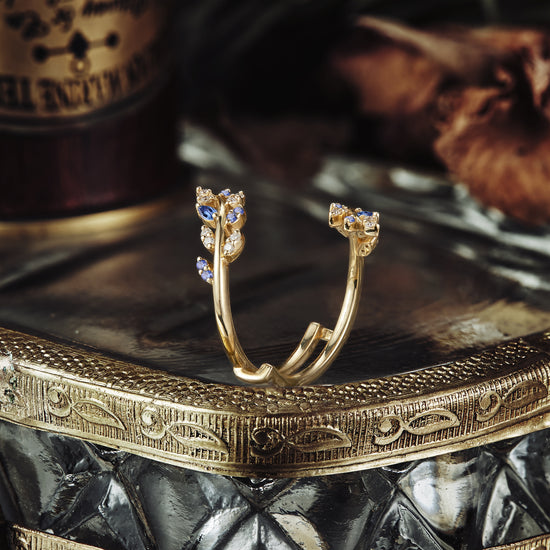 Load image into Gallery viewer, Unique gold wedding band featuring nature-inspired sapphire accents.
