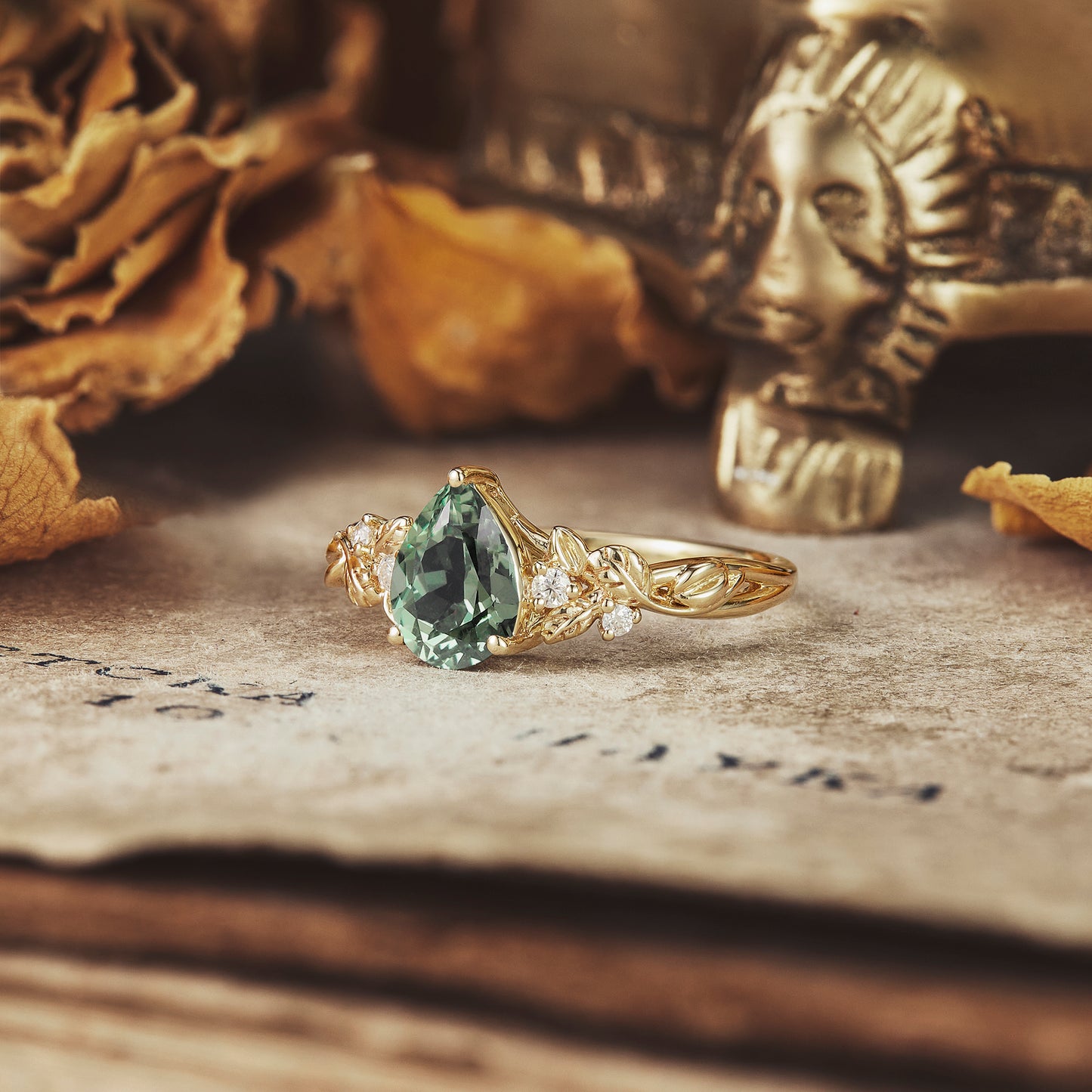 Floral-inspired green sapphire engagement ring in gold with moissanite accents