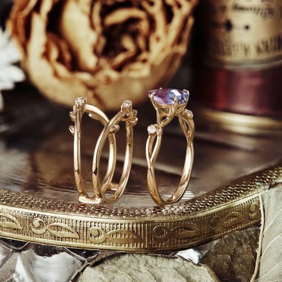 Leaf enhancer ring set with pear-cut alexandrite and unique moissanite accents.