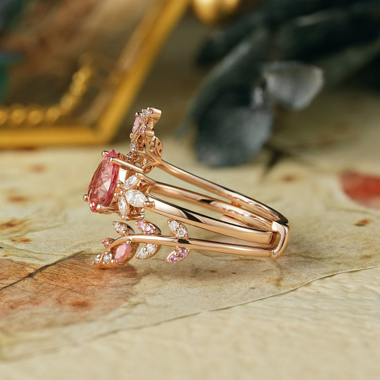 Pear-shaped padparadscha enhancer ring set with moissanite