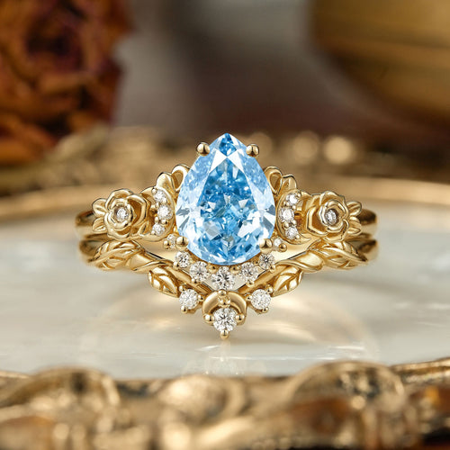 Pear Cut Lab Grown Blue Diamond Moon And Flower Inspired Bridal Ring Set