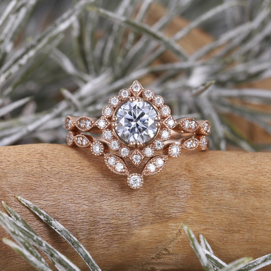 Rose gold nature-inspired gemstone ring with center stone and intricate details