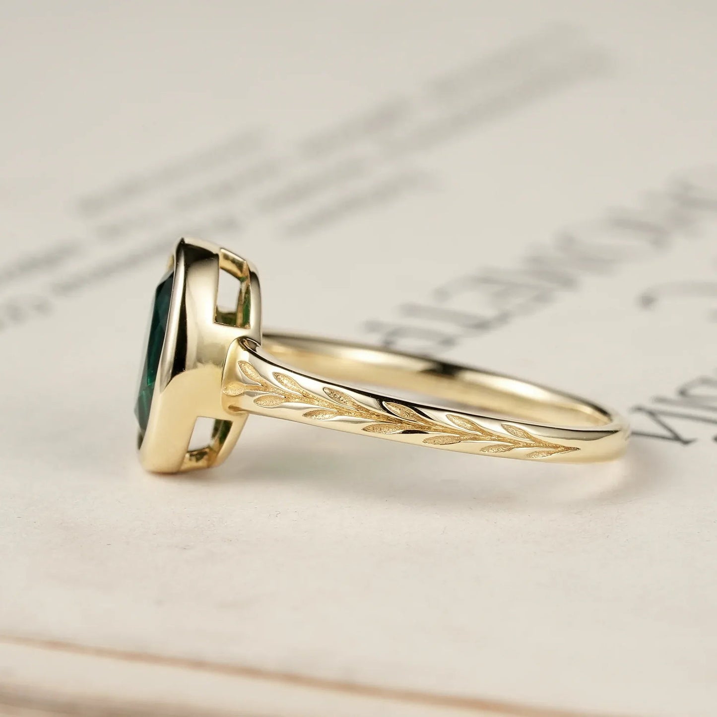 Golden Elegance: Oval Emerald Leaf Ring | Celia - GemsMagic
