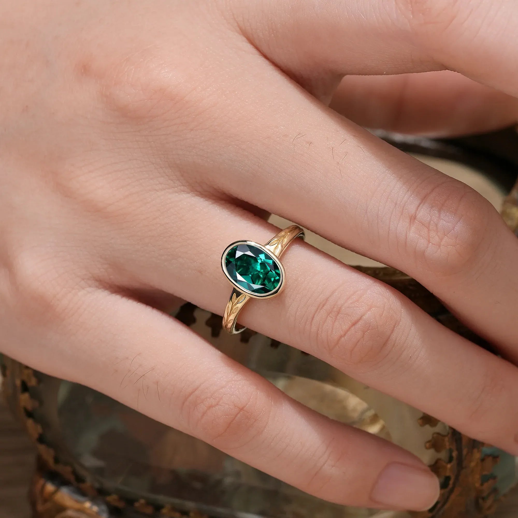 Golden Elegance: Oval Emerald Leaf Ring | Celia - GemsMagic
