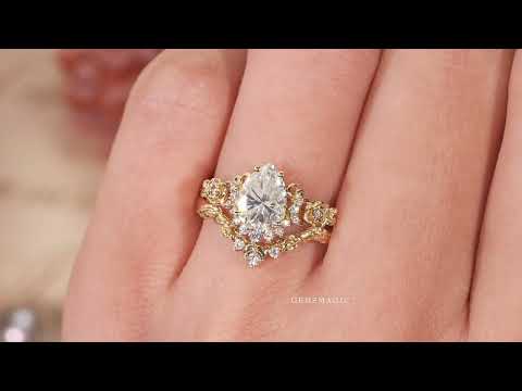 Load and play video in Gallery viewer, Pear Cut Moissanite Moon And Flower Inspired Bridal Ring Set
