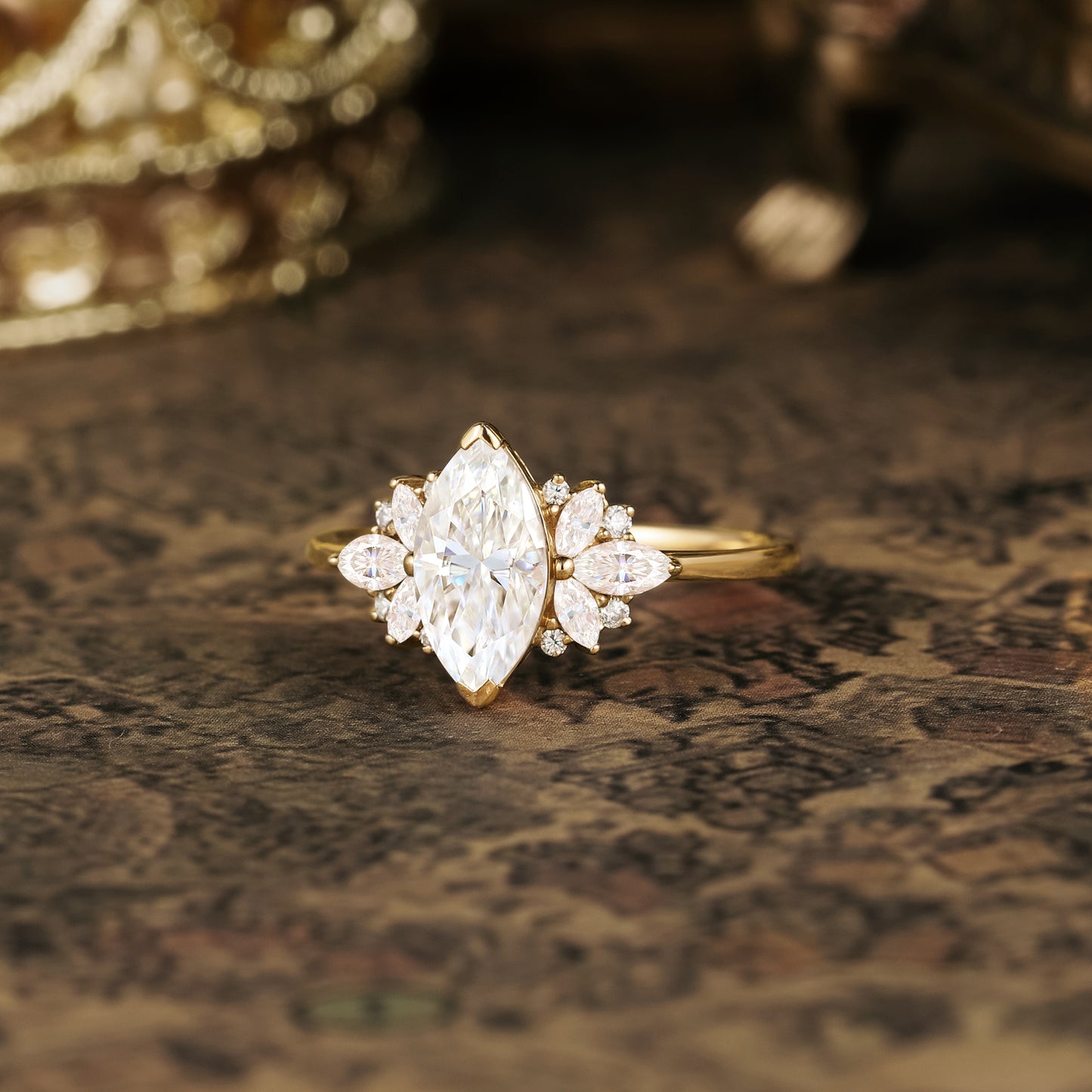 Elegant marquise moissanite ring with floral accents on vintage decor