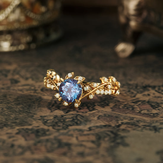 Nature-inspired gold engagement ring with lab alexandrite and moissanite accents