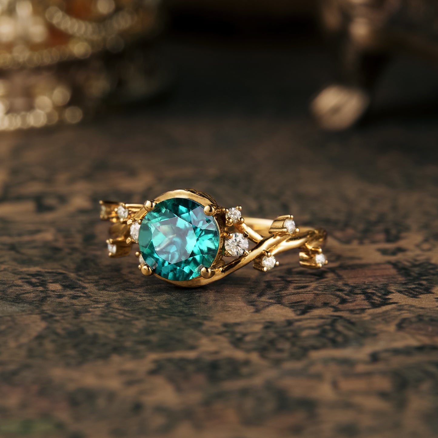 Teal round-cut gemstone ring with gold twisted band and glittering diamonds.