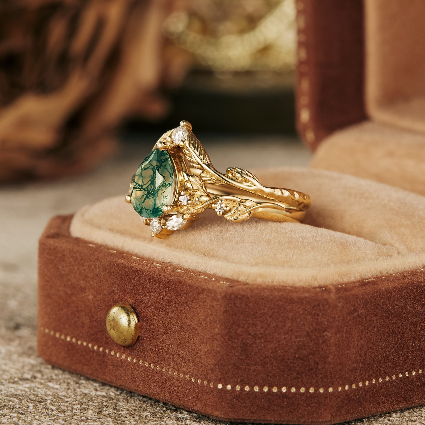 Moss Agate engagement ring with gold leaf design, featuring Moissanite accents