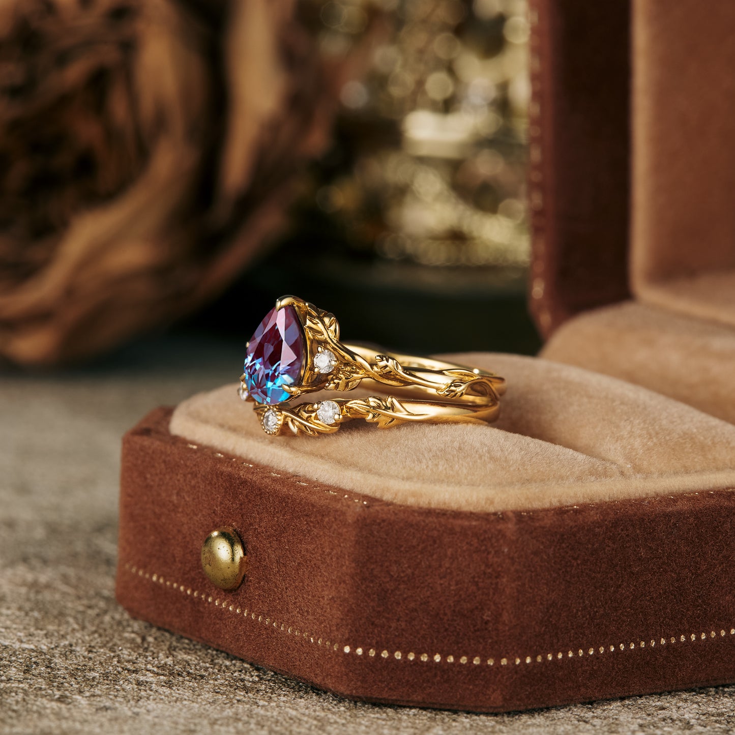 Virginia Creeper inspired gold ring set with pear-cut alexandrite and moissanite stones