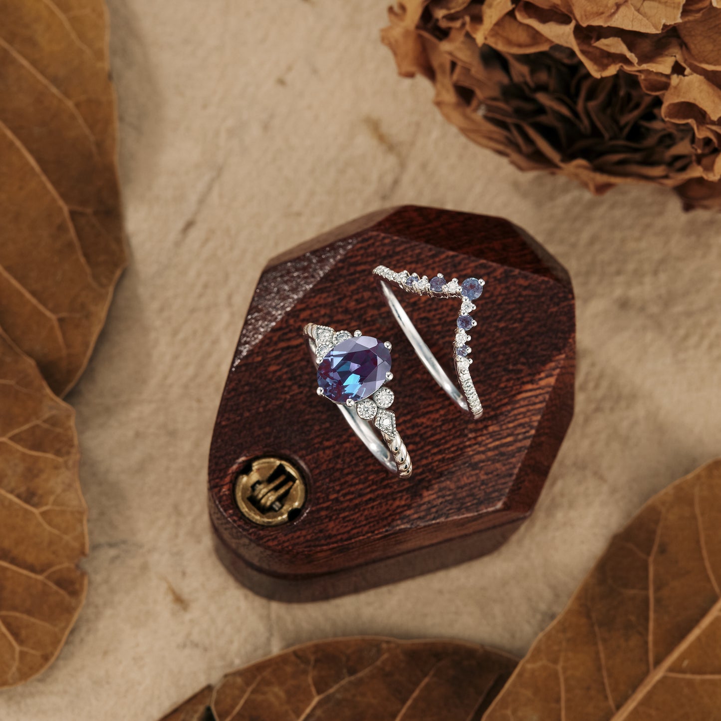 Elegant twisted engagement ring set showcasing oval alexandrite and moissanite gems.