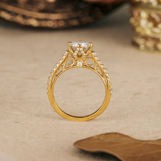 Elegant moissanite engagement ring with round stone and detailed gold band
