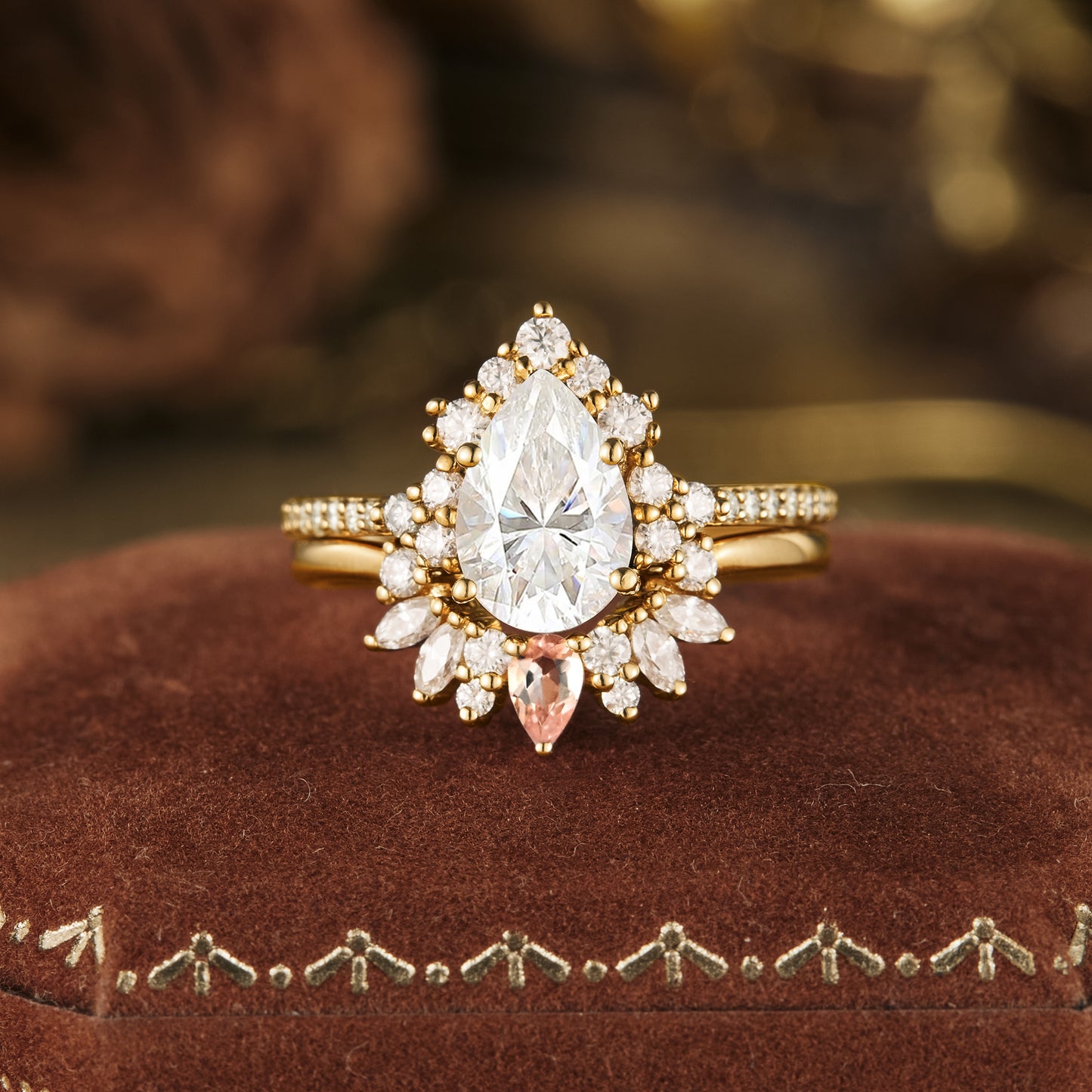 Pear-shaped Moissanite engagement ring in gold with halo setting