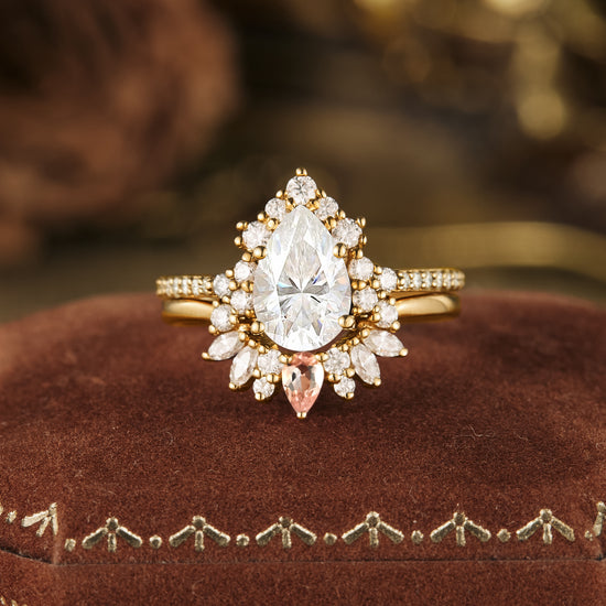 Pear-shaped Moissanite engagement ring in gold with halo setting