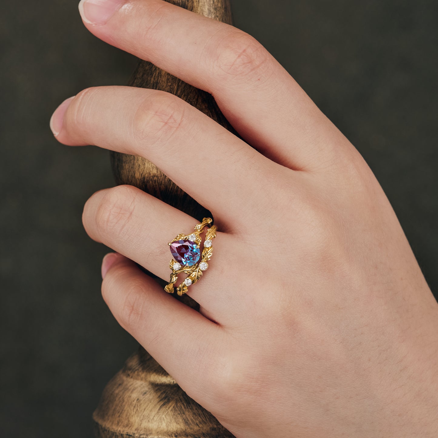 Virginia Creeper inspired gold ring set featuring pear-cut alexandrite and moissanite