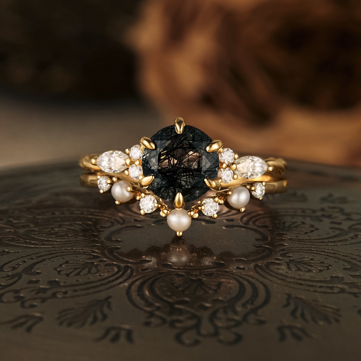 Nature-inspired black rutilated quartz and ruby engagement ring set in gold.