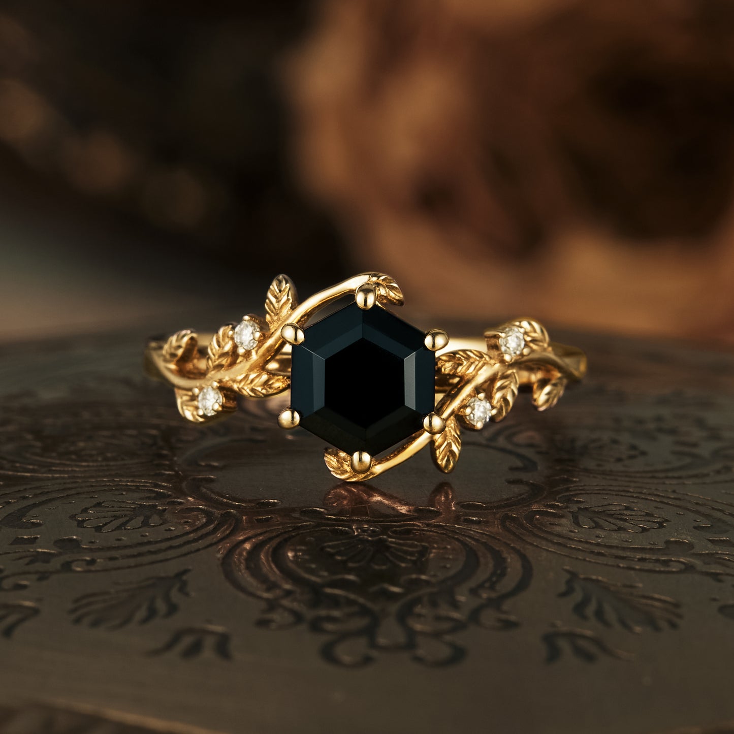 Mistletoe inspired black onyx engagement ring with leaf designs and moissanite accents