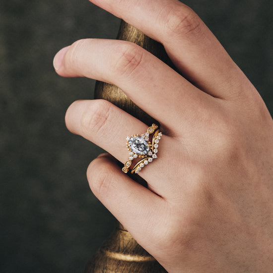 Nature-inspired gray moissanite engagement ring set on elegant display.